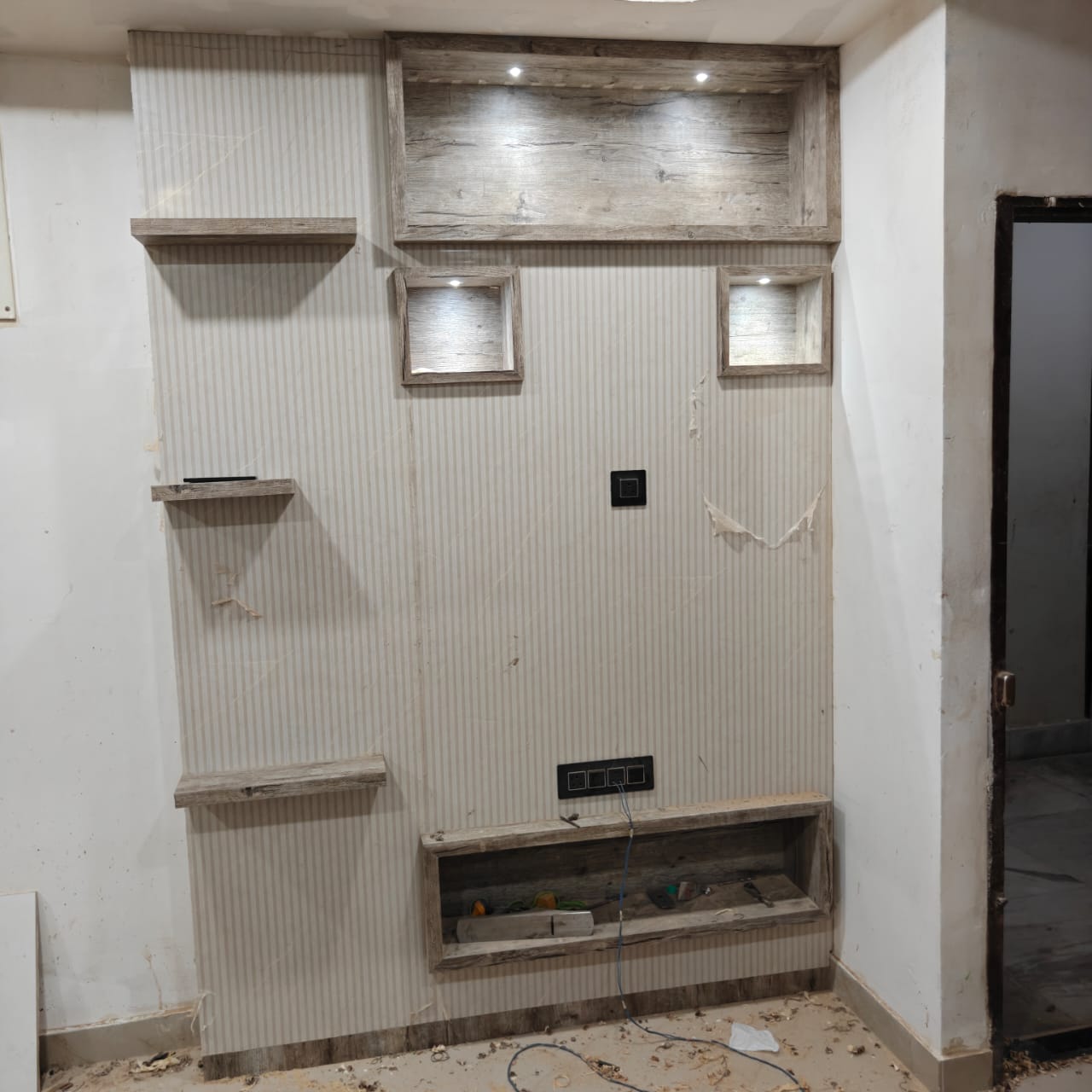 TV wall with shelving and display niches